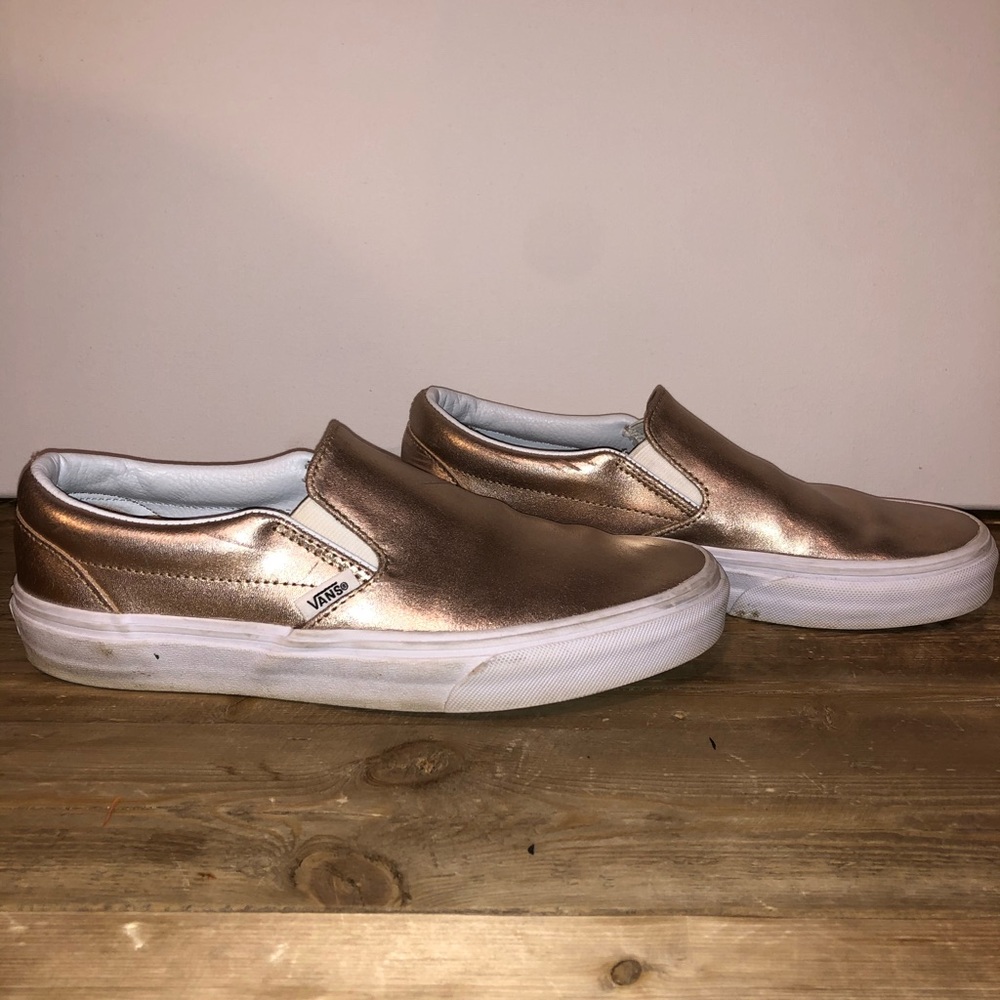 Rose gold women’s Vans sneakers.